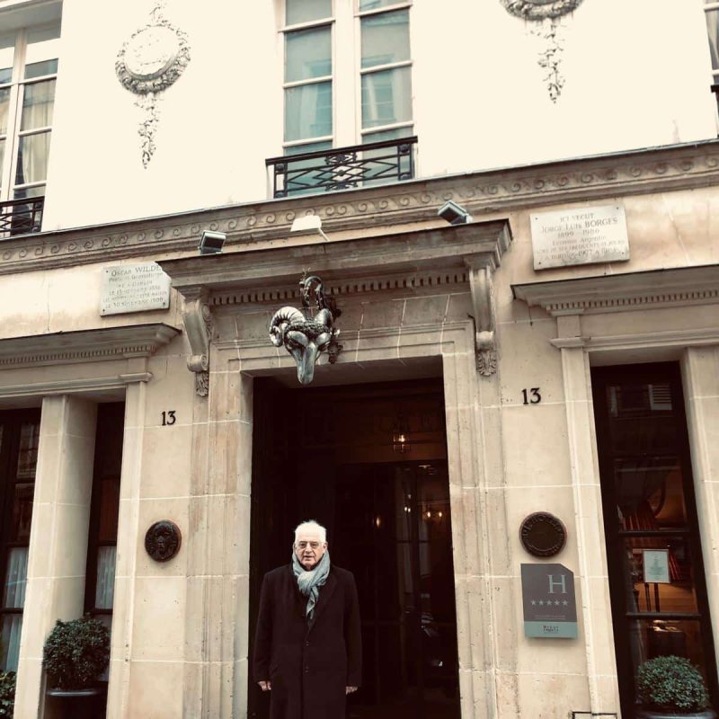 The Pere Lachaise Cemetery guide in front of the last resting place of the playwright, Oscar Wilde on this planet, then a boarding house for the poor and homeless and now a 5 star luxury hotel popular for stars like Frank Sinatra.