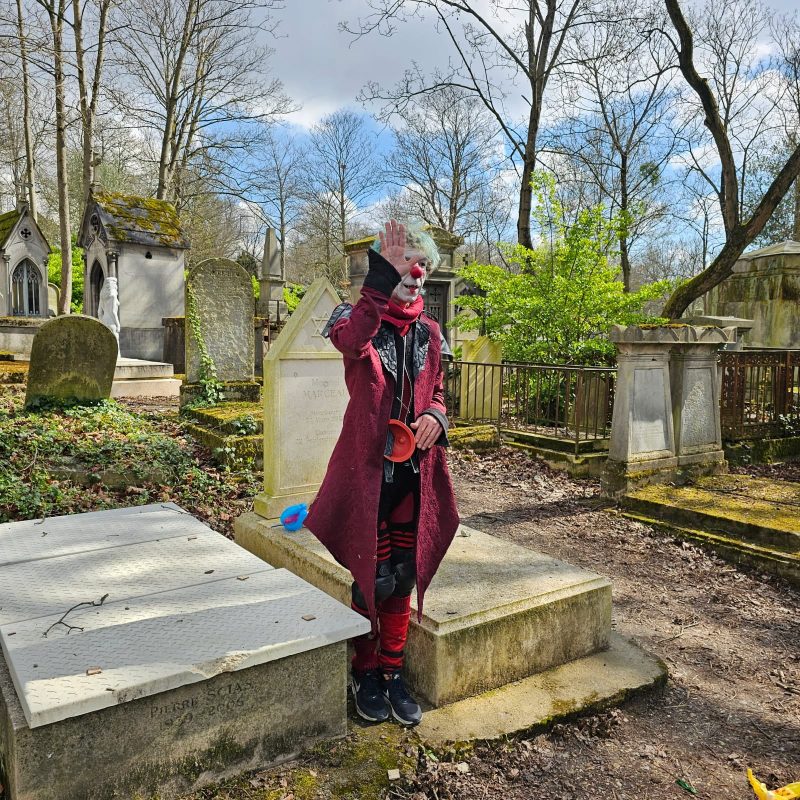 A disciple of Marcel Marceau paying his respects to the great mime artist at Père Lachaise Cemetery.