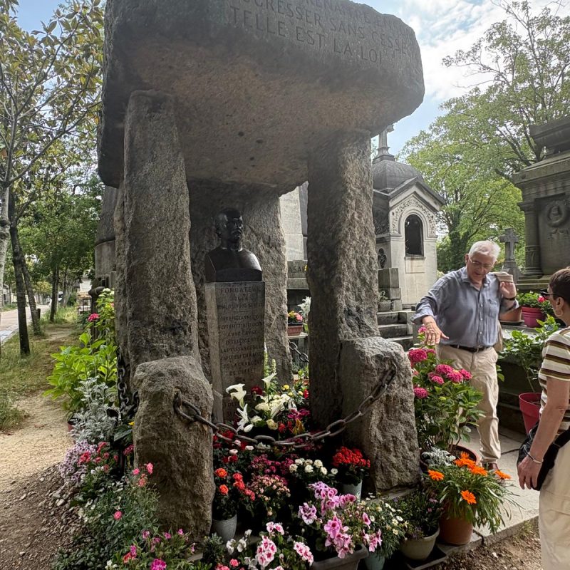 The grave of Alan Kardel, the founder of spiritualism, where a passers-by is about to make a wish !